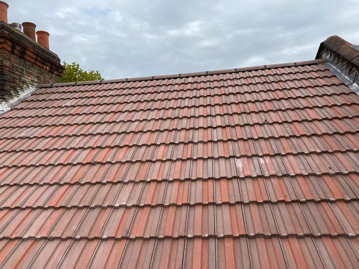 A completed red tiled roof in Kent