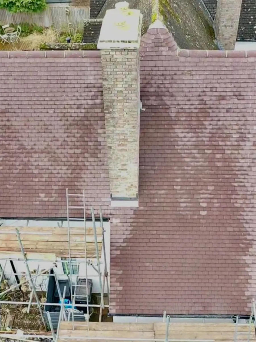 An Assured Roofing Kent roofer at work on a roof