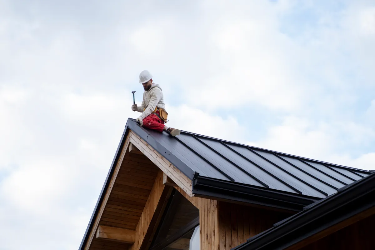 A commercial flat roof being installed on an industrial unit